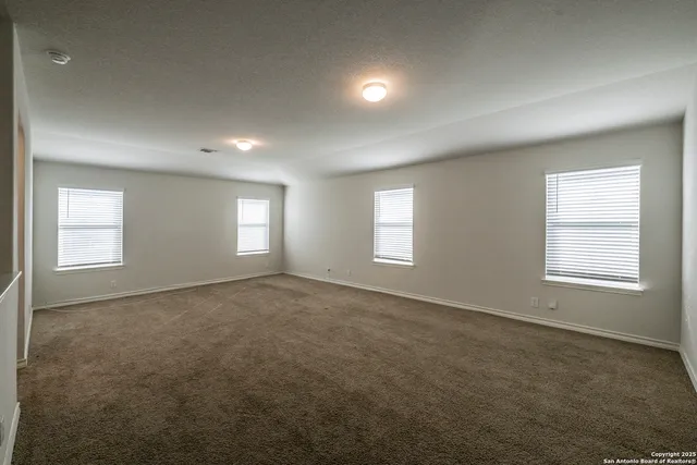 a view of empty room with windows