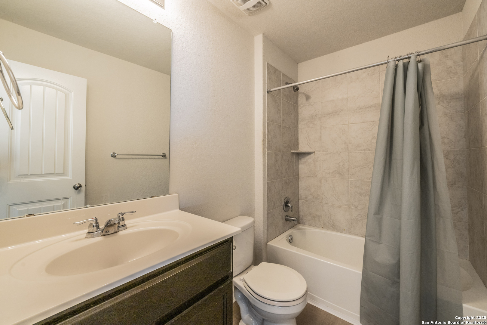 5914 Lazo Valley San Antonio, TX 78244 - Photo 37 of 40 a bathroom with a granite countertop sink toilet and shower