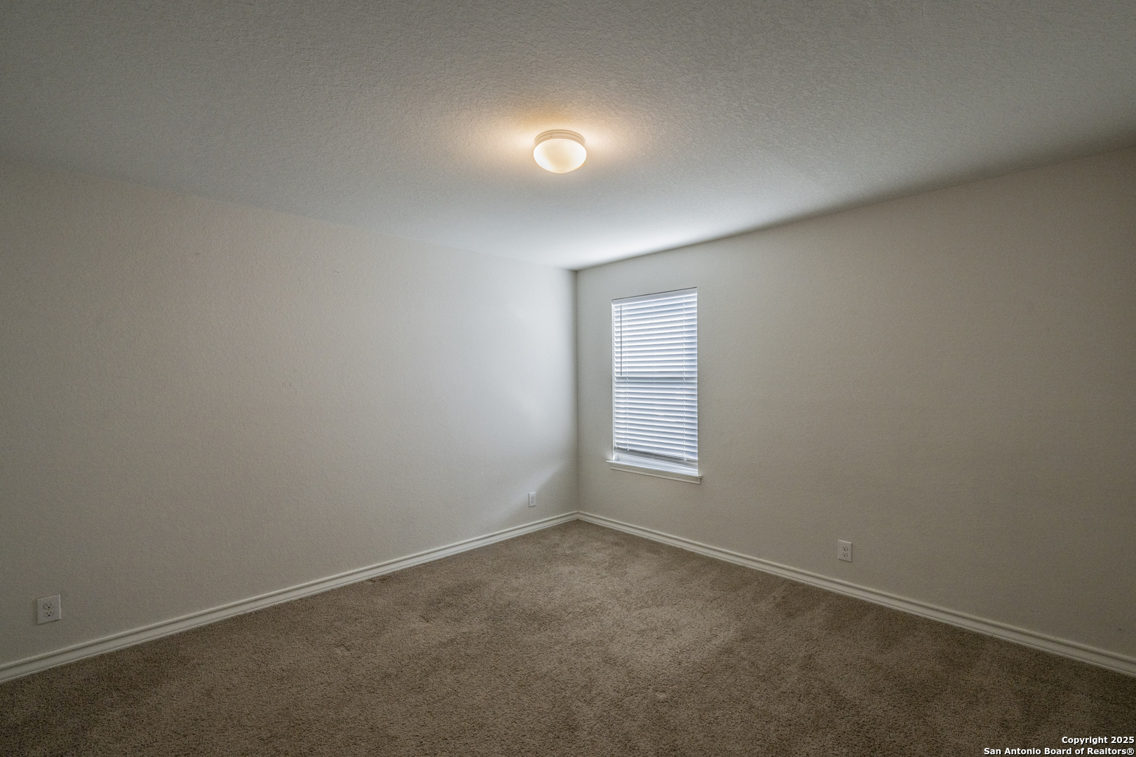 5914 Lazo Valley San Antonio, TX 78244 - Photo 38 of 40 an empty room with a empty space and window
