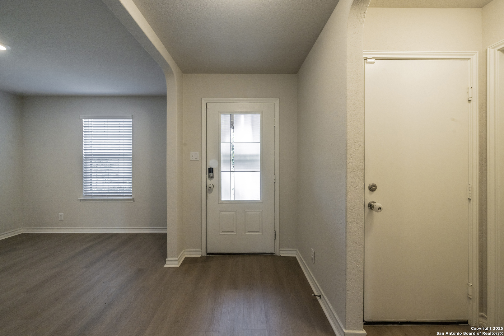 5914 Lazo Valley San Antonio, TX 78244 - Photo 7 of 40 an empty room with wooden floor and windows