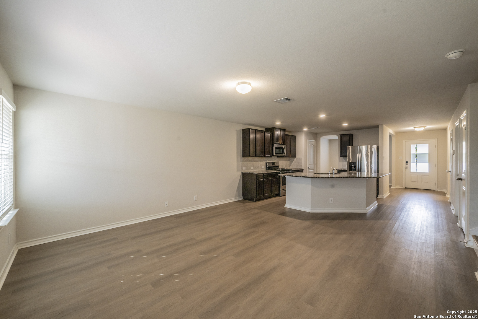 5914 Lazo Valley San Antonio, TX 78244 - Photo 10 of 40 a view of kitchen with kitchen island wooden floor and center island