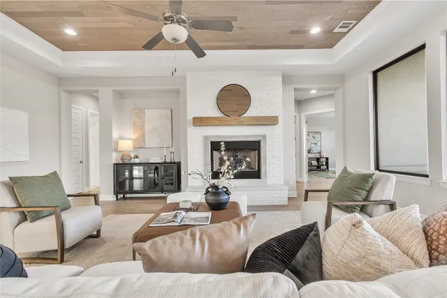 a living room with furniture and a fireplace