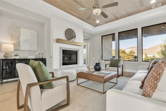 a living room with furniture a fireplace