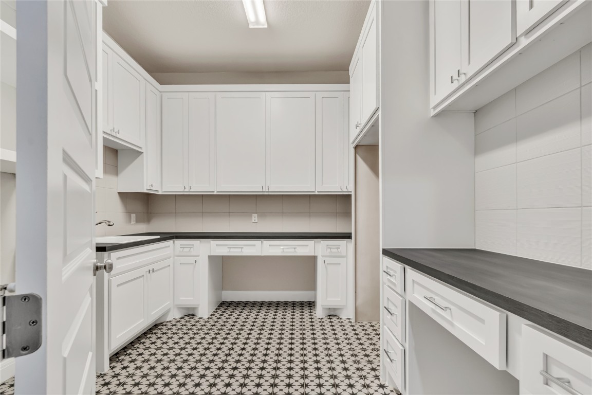 1700 Jackpot Run Leander, TX 78641 - Photo 17 of 40 a kitchen with a sink cabinets and appliances