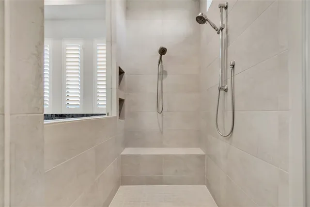 a white bath tub sitting in a bathroom