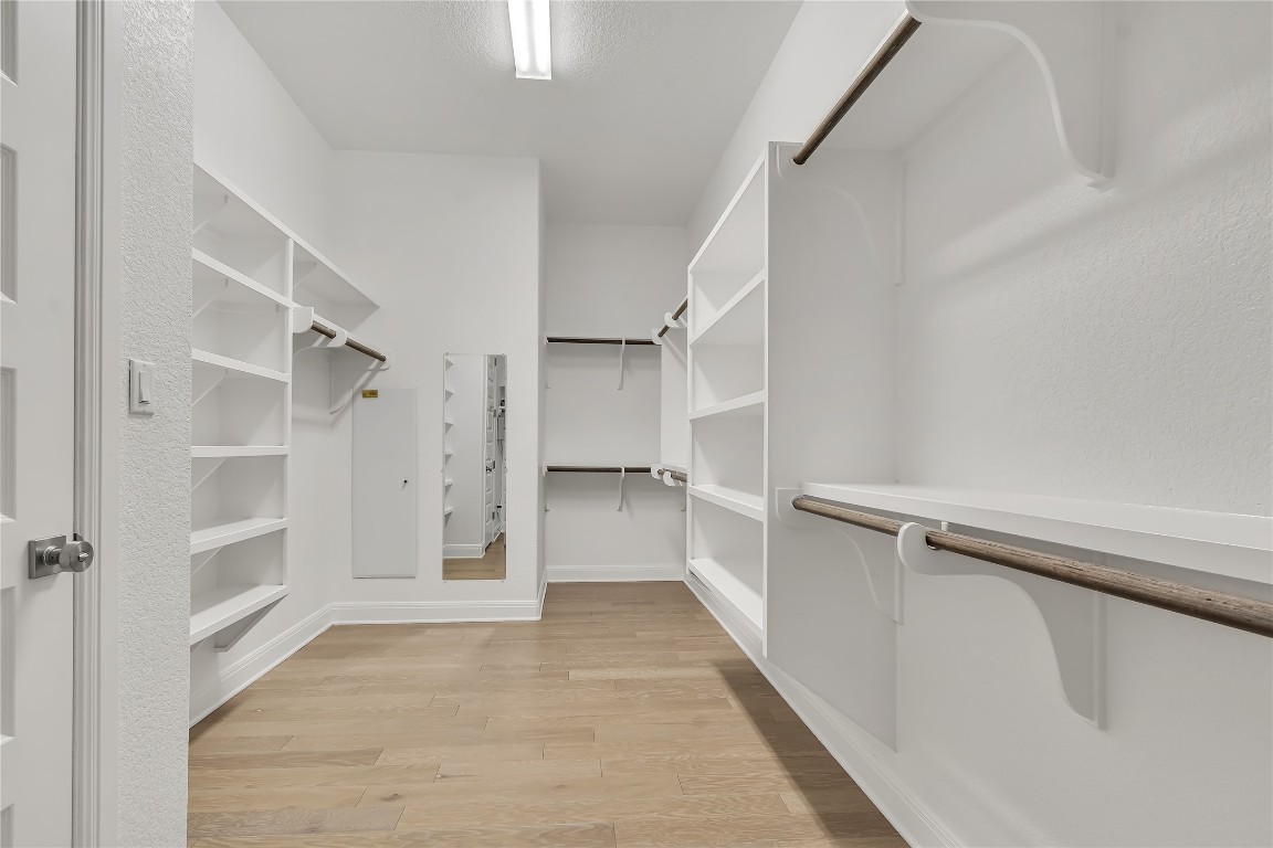 1700 Jackpot Run Leander, TX 78641 - Photo 27 of 40 a view of walk in closet with empty racks
