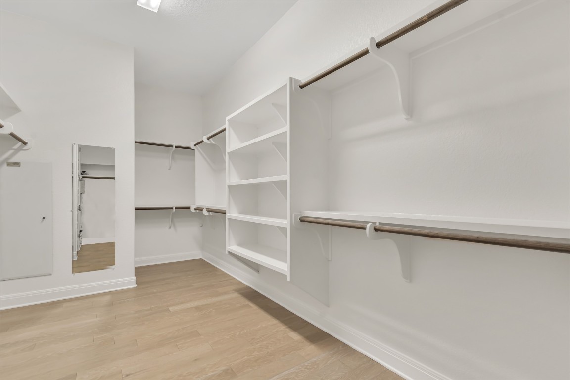 1700 Jackpot Run Leander, TX 78641 - Photo 28 of 40 a view of walk in closet with empty racks