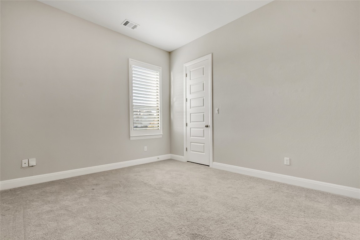 1700 Jackpot Run Leander, TX 78641 - Photo 31 of 40 a view of an empty room with a window