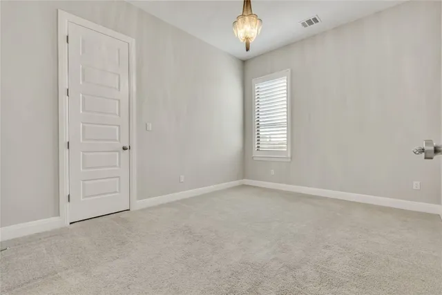 a bathroom with a tub a sink and mirror
