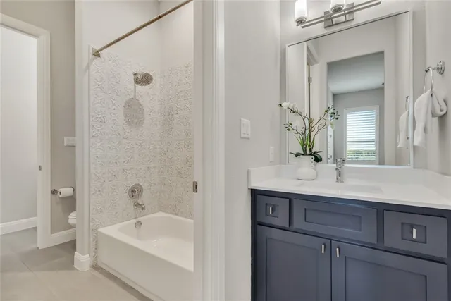 a living room with furniture a fireplace and a table with wooden floor
