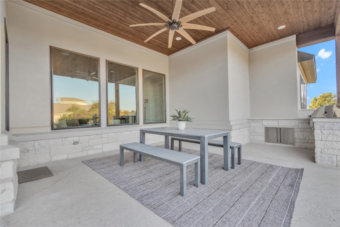 1700 Jackpot Run Leander, TX 78641 - Photo 36 of 40 a living room with furniture a fireplace and a table with wooden floor