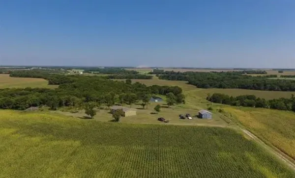 a view of a green field with an outdoor space