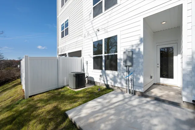 a view of a house with backyard and porch