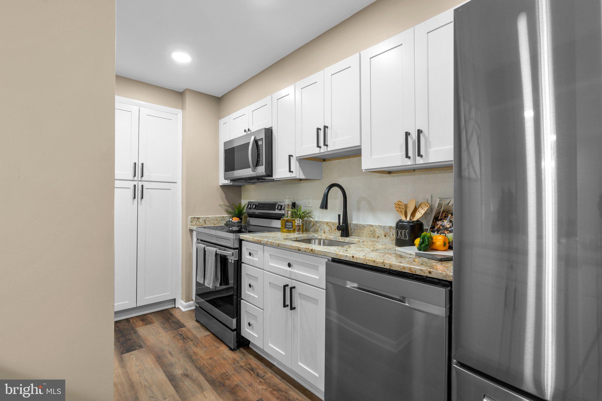 111 Hamlet Hill Road, Unit 413 Baltimore, MD 21210 - Photo 14 of 50 Gutted and renovated kitchen w- wood cabinets...