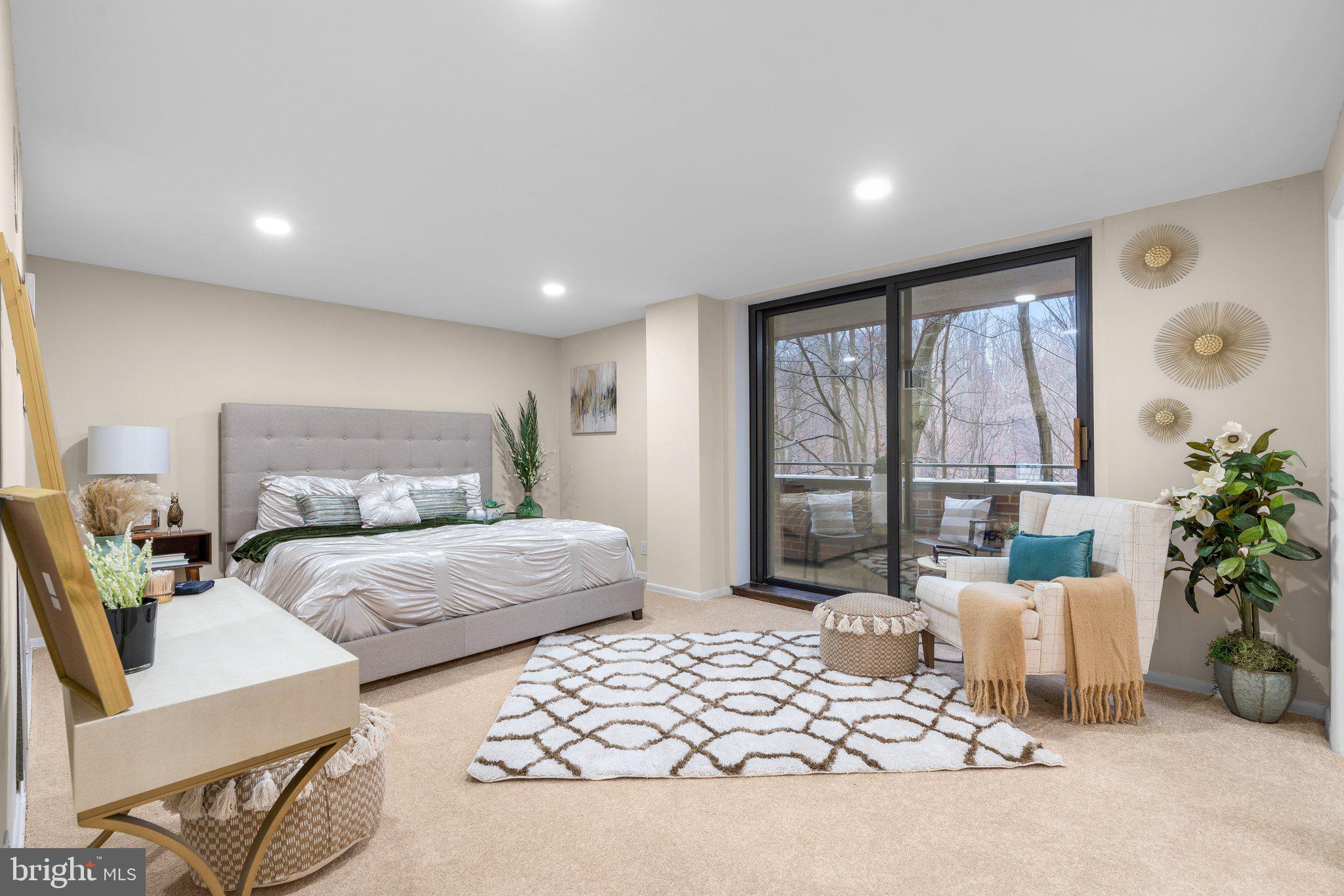 111 Hamlet Hill Road, Unit 413 Baltimore, MD 21210 - Photo 23 of 50 Primary bedroom w-sliding doors to the balcony.