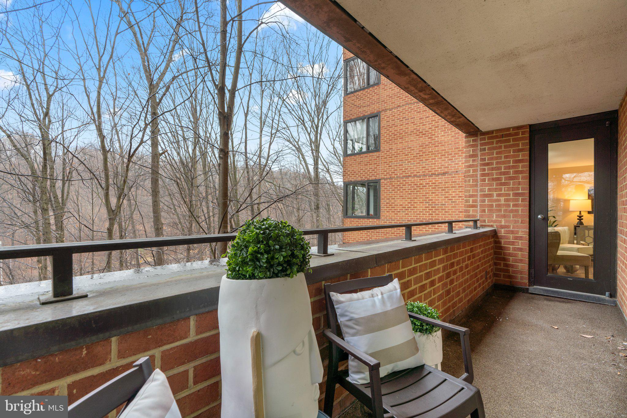 111 Hamlet Hill Road, Unit 413 Baltimore, MD 21210 - Photo 33 of 50 Balcony opens to living room and primary bedroom.