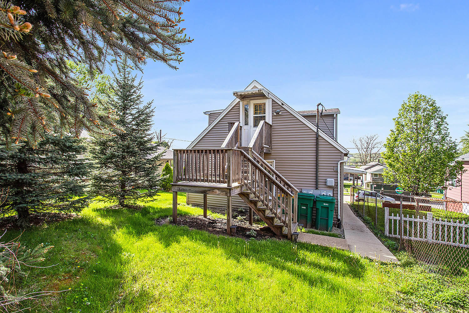 512 Porter Street, Unit B Lemont, IL 60439 - Photo 17 of 22 a view of a house with a small yard and a big yard