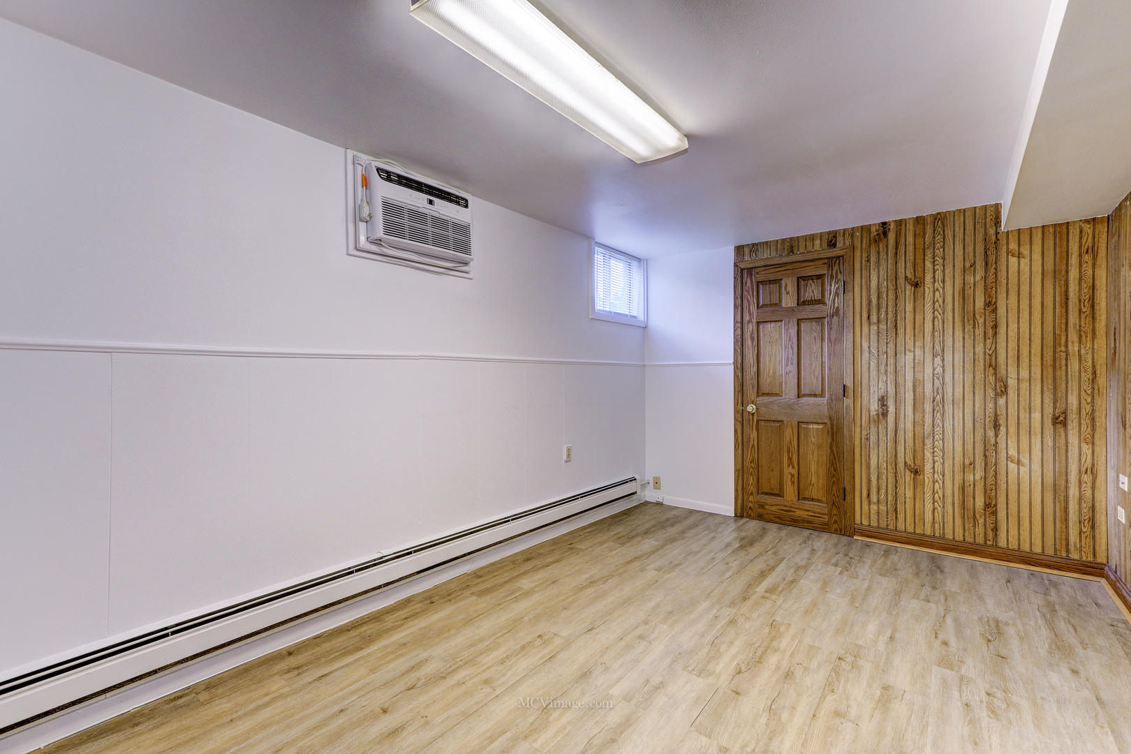 512 Porter Street, Unit B Lemont, IL 60439 - Photo 7 of 22 an empty room with wooden floor