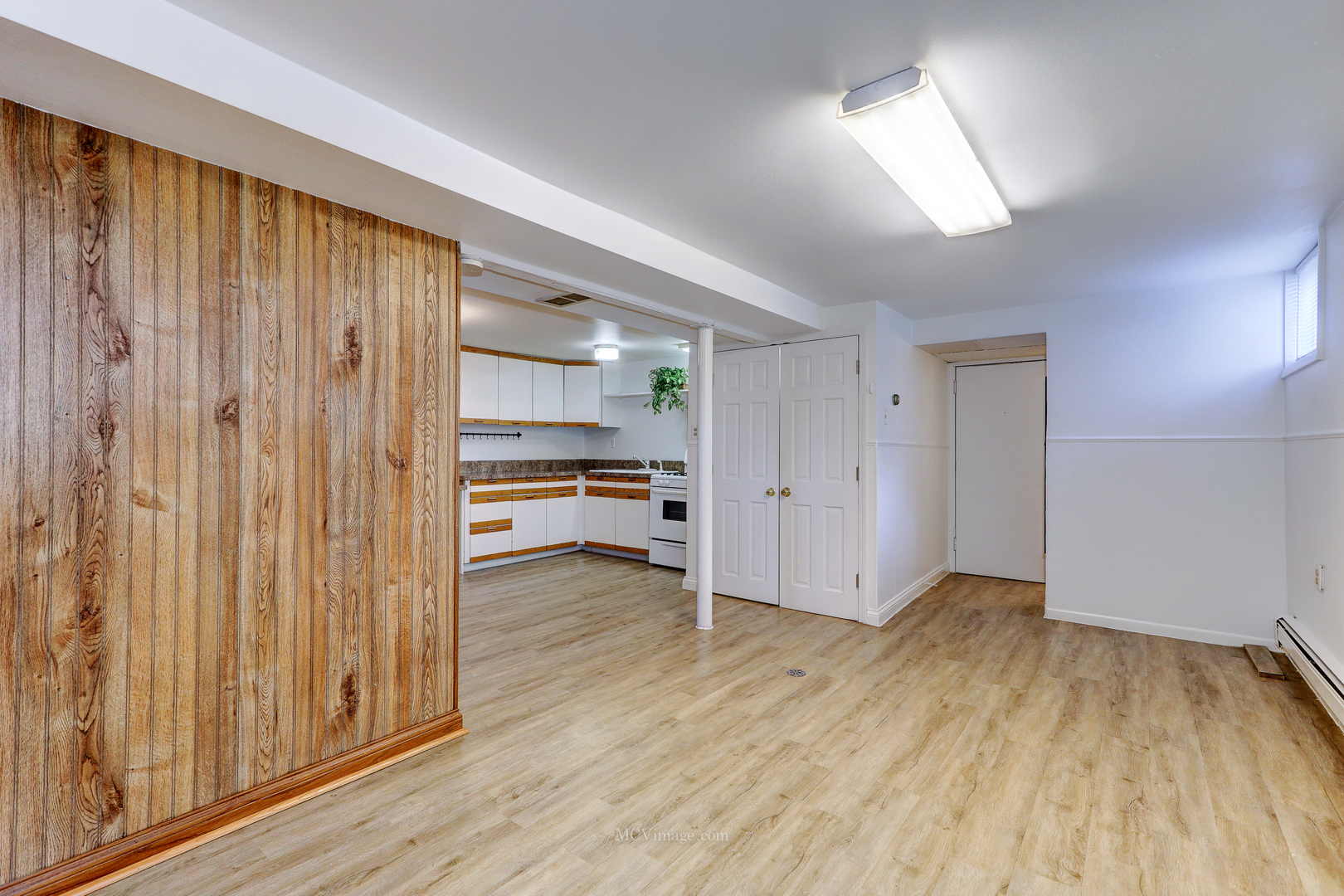 512 Porter Street, Unit B Lemont, IL 60439 - Photo 9 of 22 a view of a room with wooden floor closet and windows