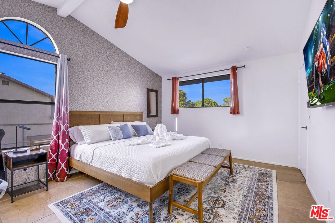 45808 Sutter Creek Road Indio, CA 92201 - Photo 19 of 33 a bedroom with a bed a dresser and book shelf