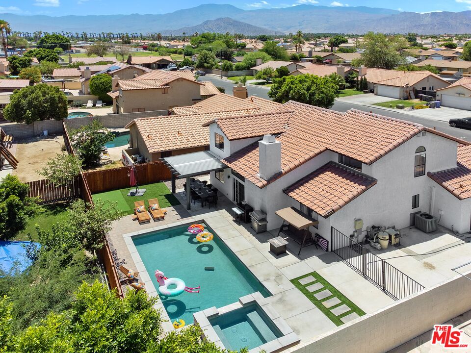 45808 Sutter Creek Road Indio, CA 92201 - Photo 2 of 33 an aerial view of a house with a garden
