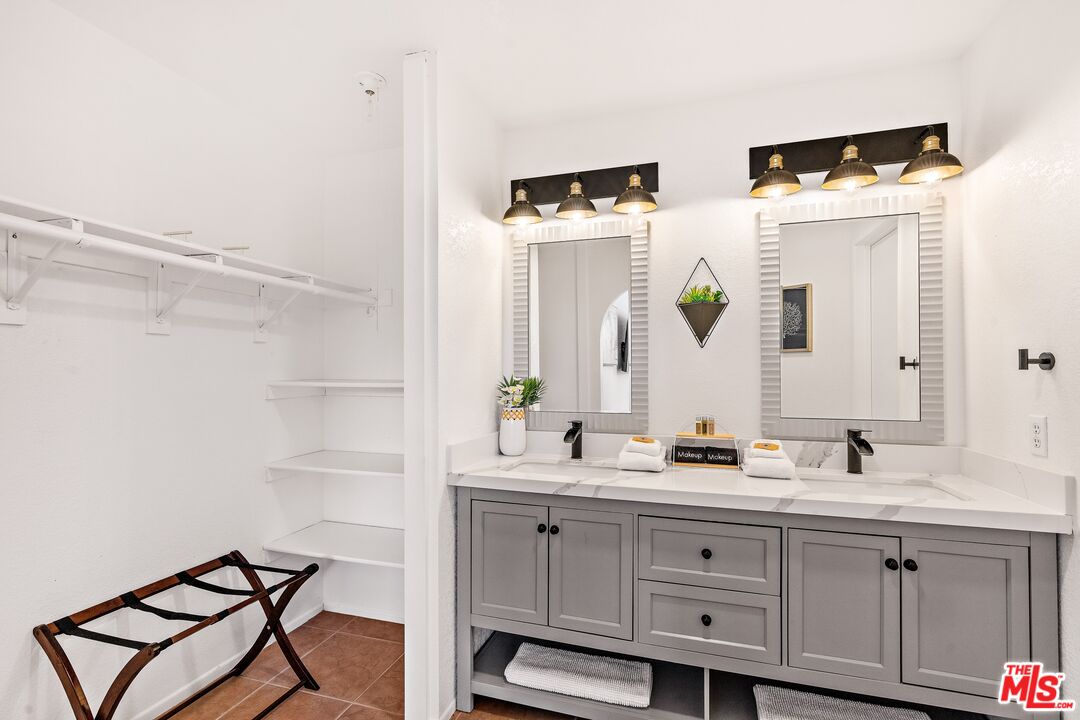 45808 Sutter Creek Road Indio, CA 92201 - Photo 21 of 33 a bathroom with a double vanity sink mirror and