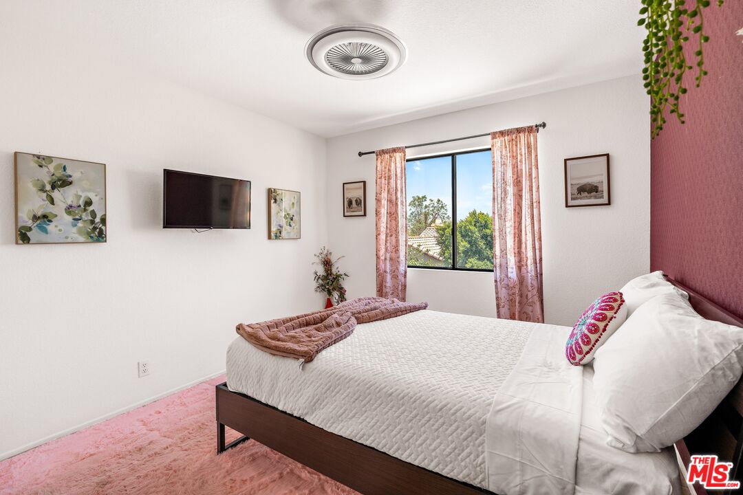 45808 Sutter Creek Road Indio, CA 92201 - Photo 24 of 33 a bedroom with a bed and a window