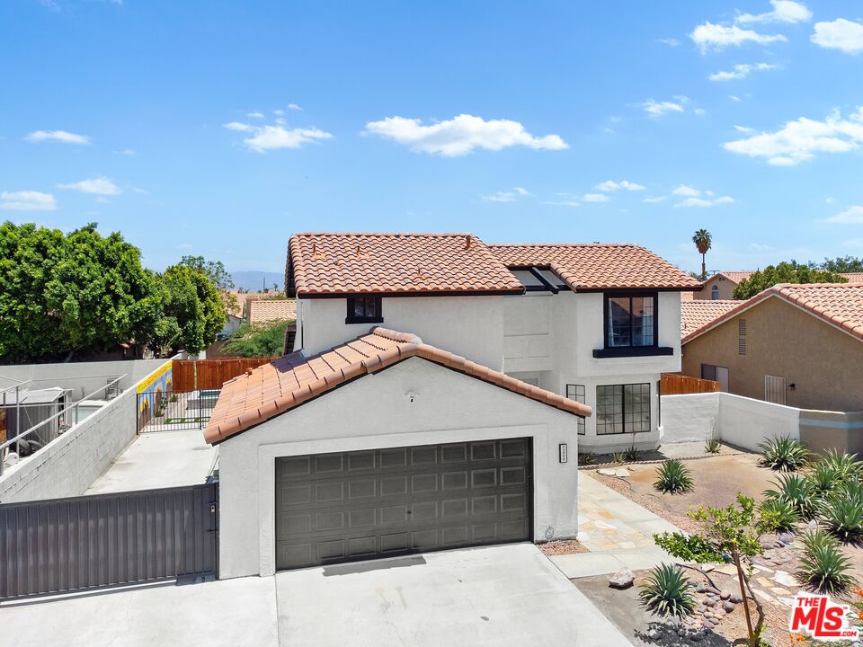 45808 Sutter Creek Road Indio, CA 92201 - Photo 30 of 33 a front view of a house with a yard