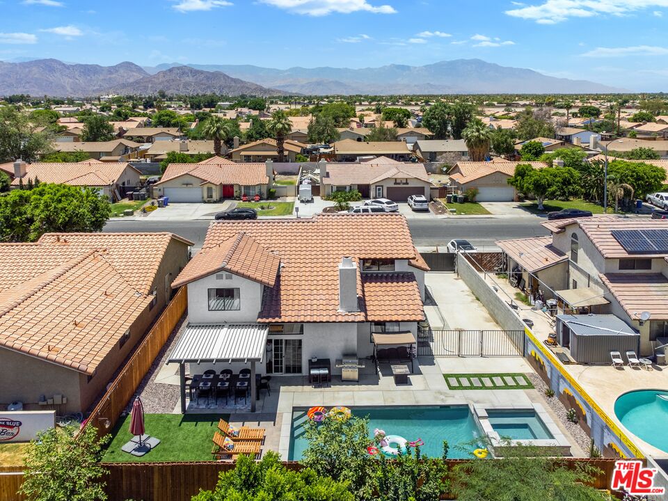 45808 Sutter Creek Road Indio, CA 92201 - Photo 32 of 33 a view of a city with lots of residential buildings ocean and mountain view in back