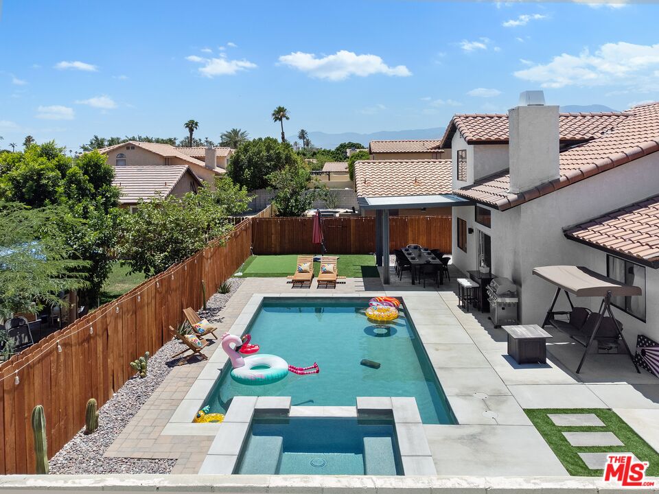 45808 Sutter Creek Road Indio, CA 92201 - Photo 4 of 33 a view of swimming pool with seating space