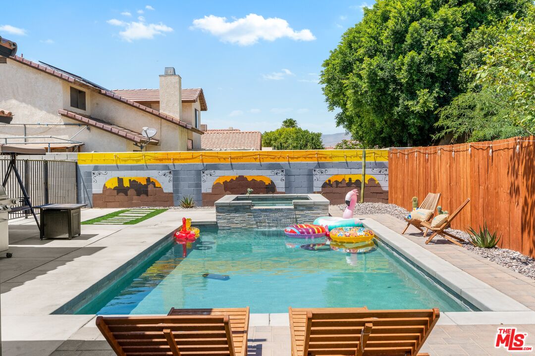 45808 Sutter Creek Road Indio, CA 92201 - Photo 5 of 33 a view of swimming pool with chairs and yard