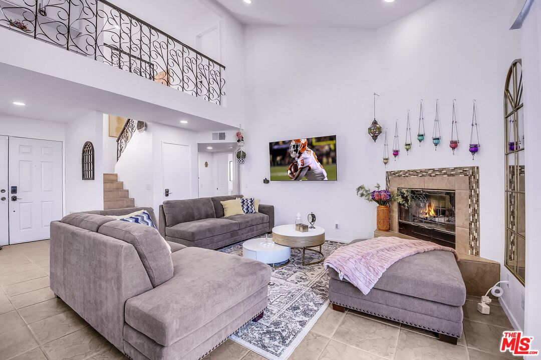 45808 Sutter Creek Road Indio, CA 92201 - Photo 9 of 33 a living room with furniture and a fireplace