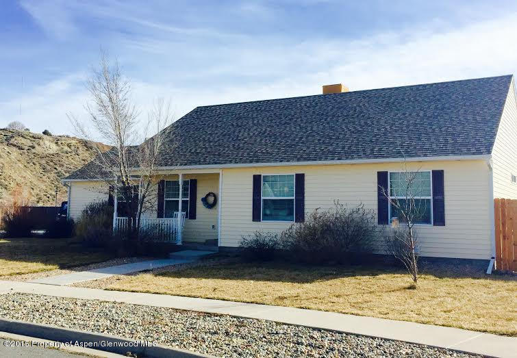 300 Columbine Drive Rifle, CO 81650 - Photo 1 of 8 a front view of a house with a yard