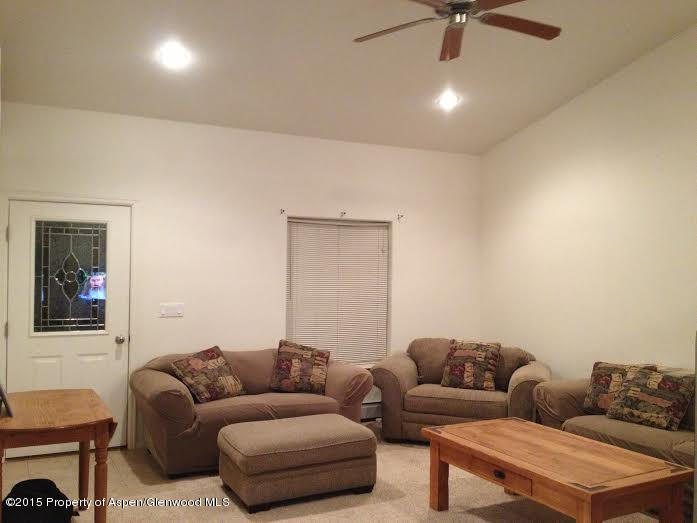 300 Columbine Drive Rifle, CO 81650 - Photo 6 of 8 a living room with furniture and a window