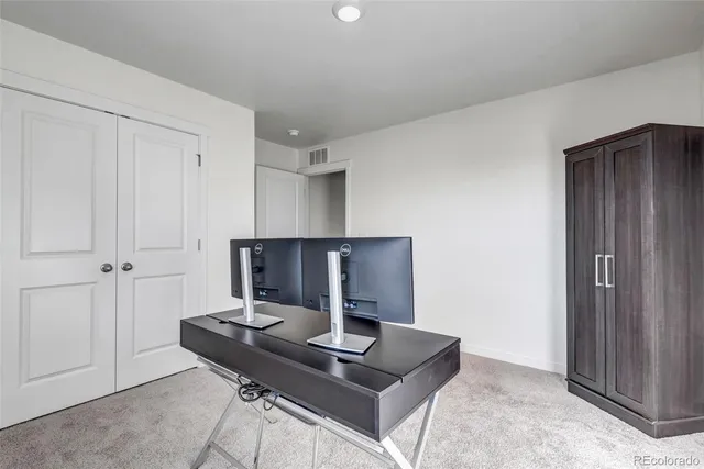 a view of a workspace with furniture