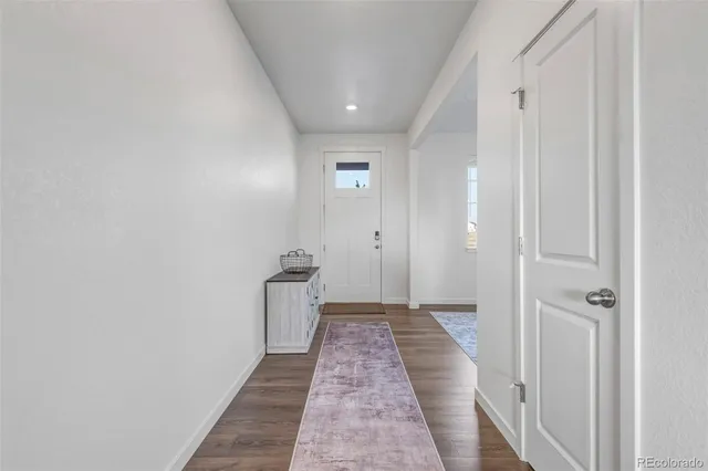 a view of a hallway with a door