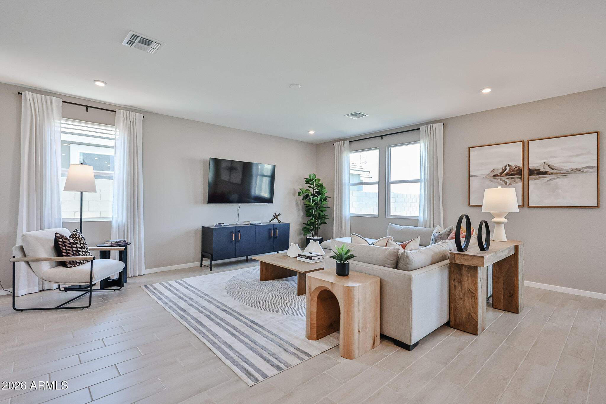 12466 North 305th Avenue Buckeye, AZ 85396 - Photo 13 of 51 a living room with furniture and a flat screen tv