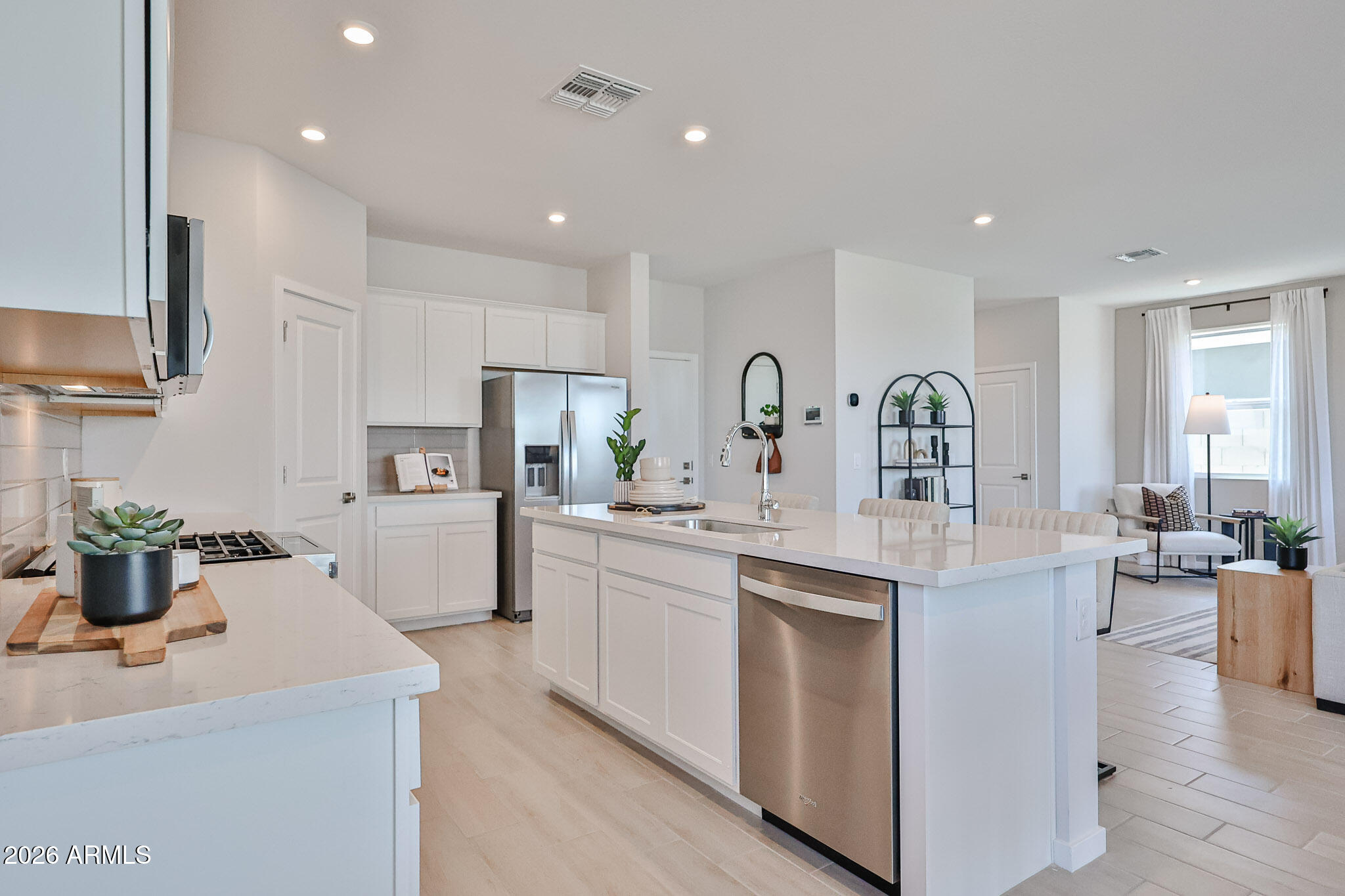 12466 North 305th Avenue Buckeye, AZ 85396 - Photo 15 of 51 a kitchen with sink a stove and cabinets