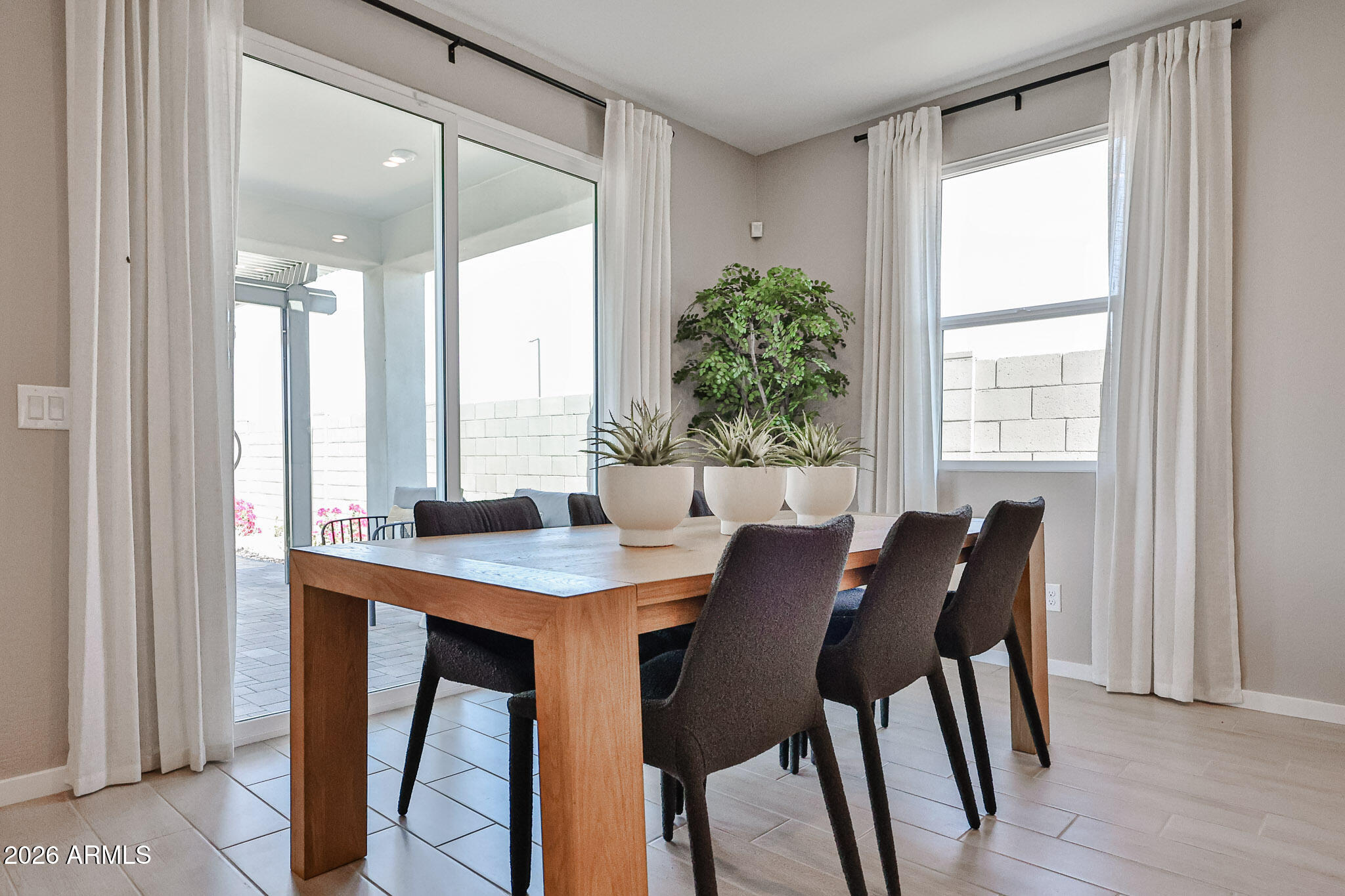12466 North 305th Avenue Buckeye, AZ 85396 - Photo 16 of 51 a view of a dining room with furniture and window