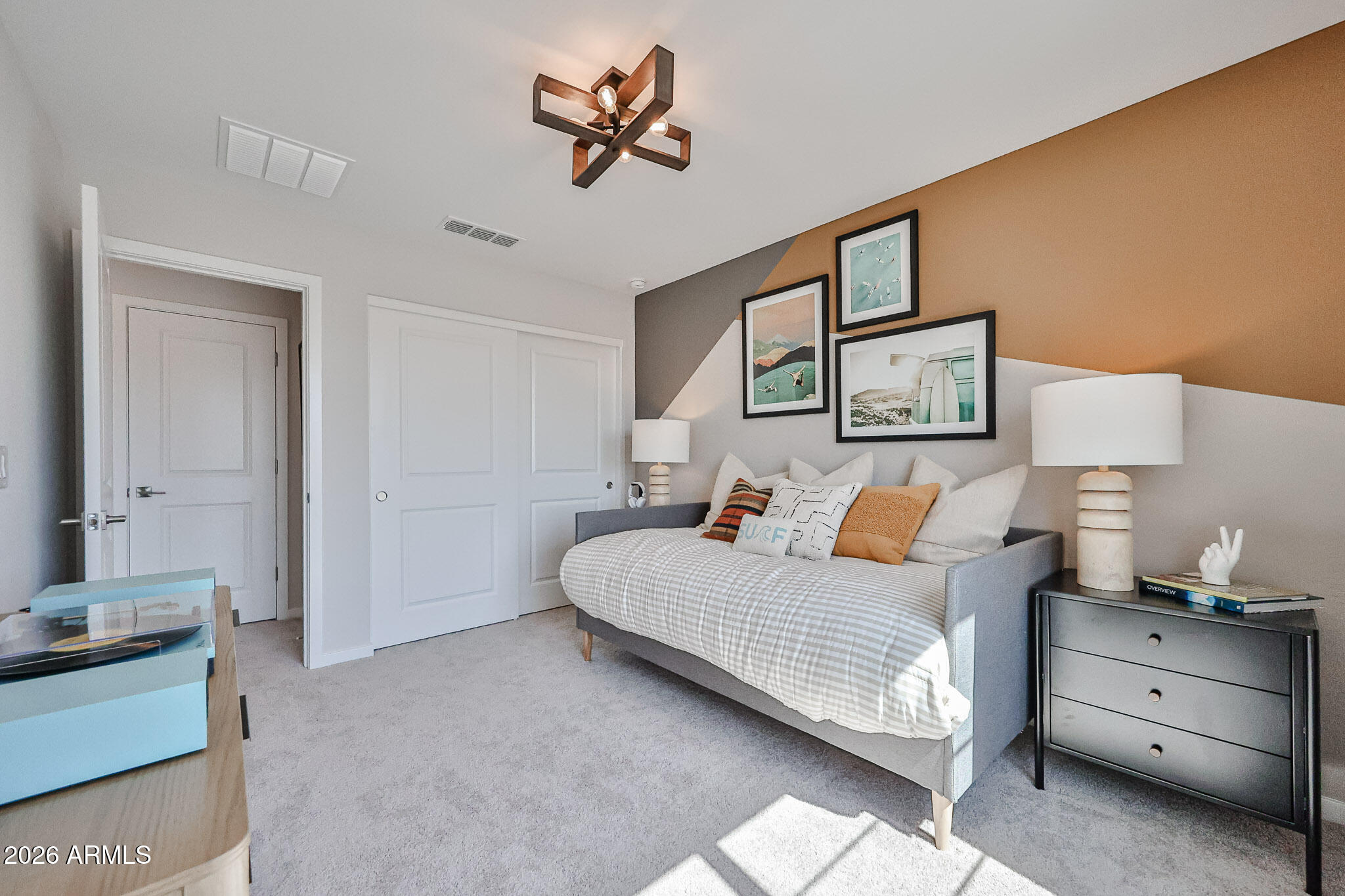 12466 North 305th Avenue Buckeye, AZ 85396 - Photo 17 of 51 a bedroom with a bed and a chandelier