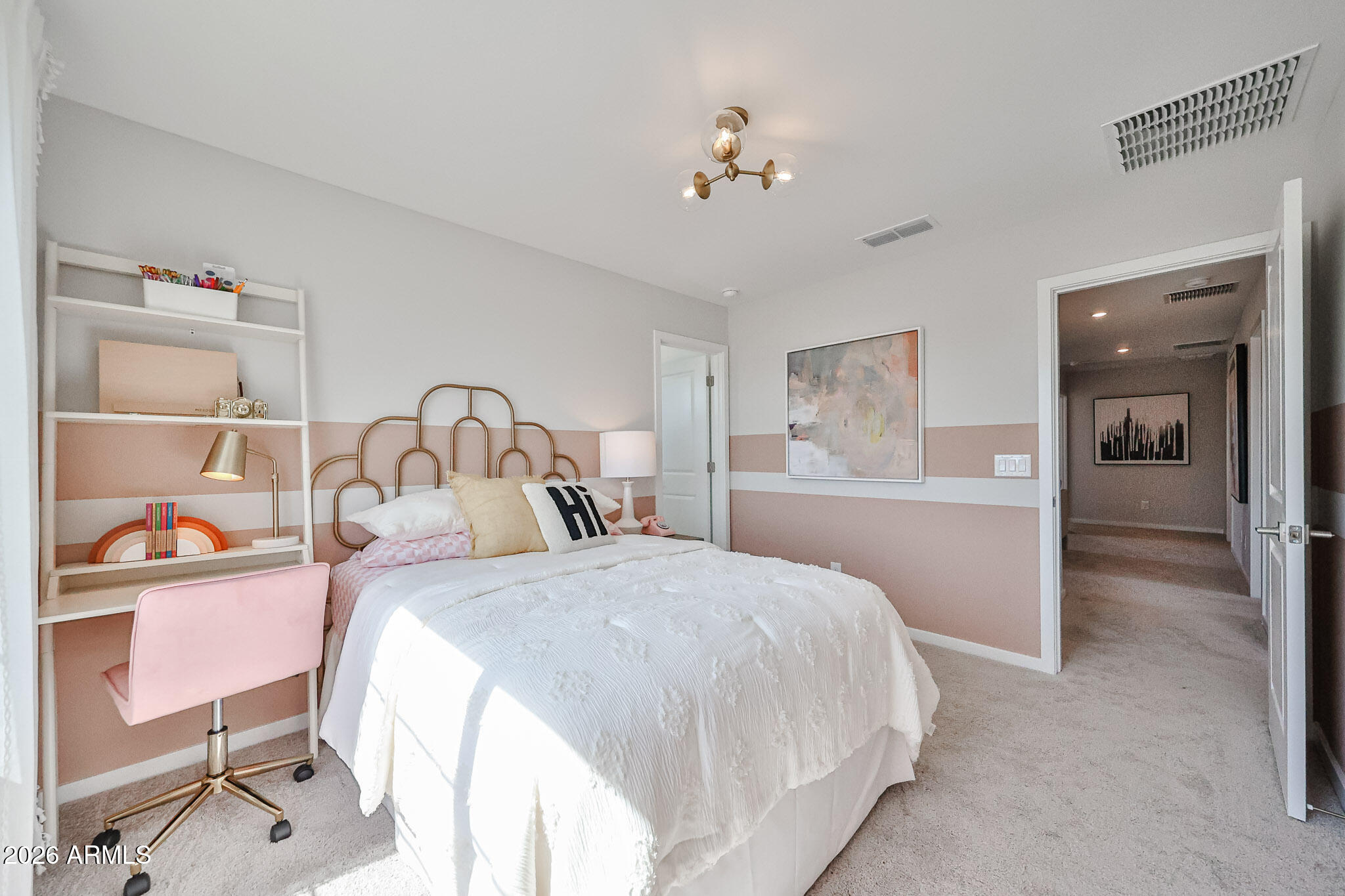 12466 North 305th Avenue Buckeye, AZ 85396 - Photo 18 of 51 a bedroom with a bed and a table in it