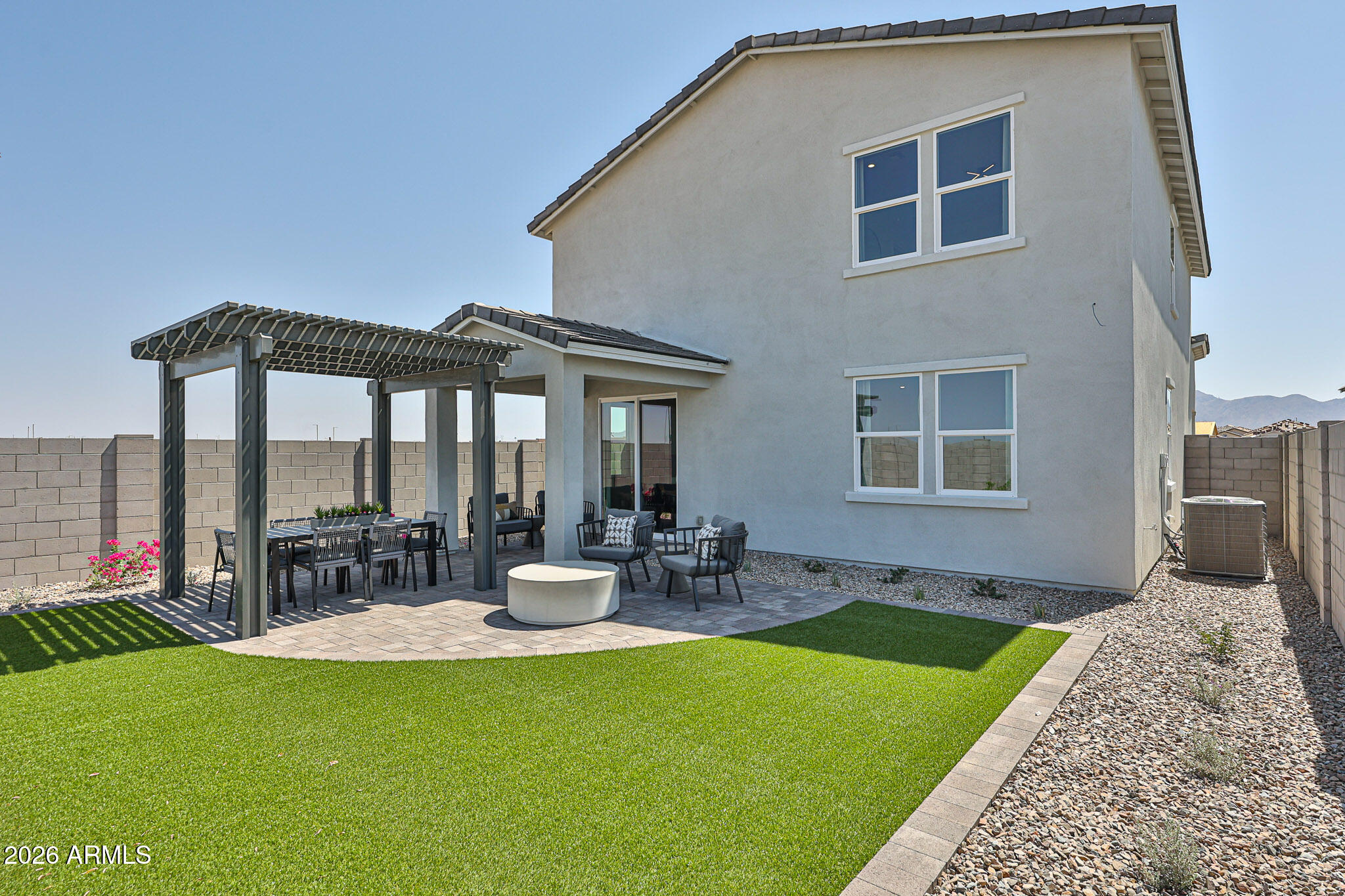 12466 North 305th Avenue Buckeye, AZ 85396 - Photo 22 of 51 a front view of house with yard and outdoor seating