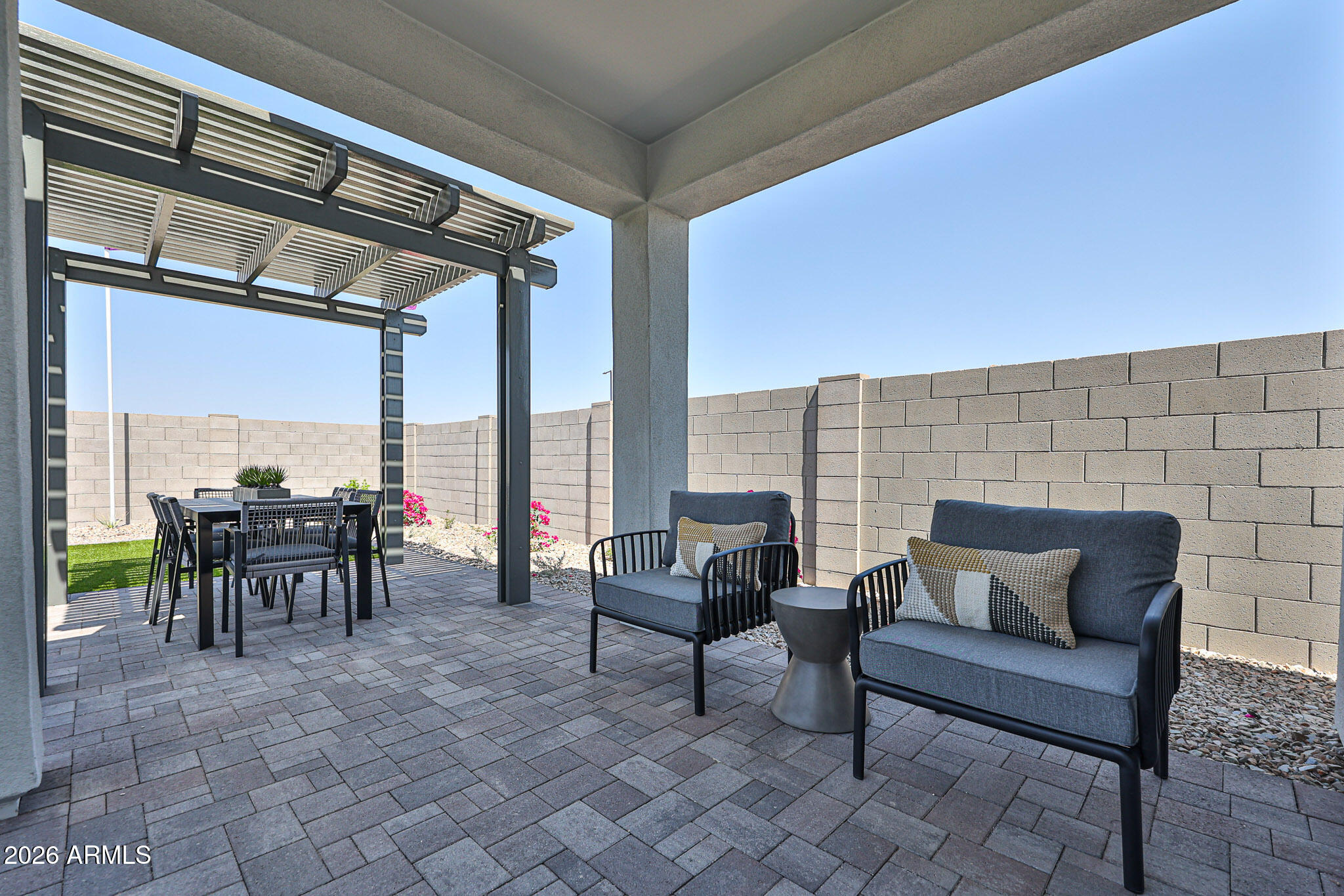 12466 North 305th Avenue Buckeye, AZ 85396 - Photo 30 of 51 a view of a patio with dining table and chairs