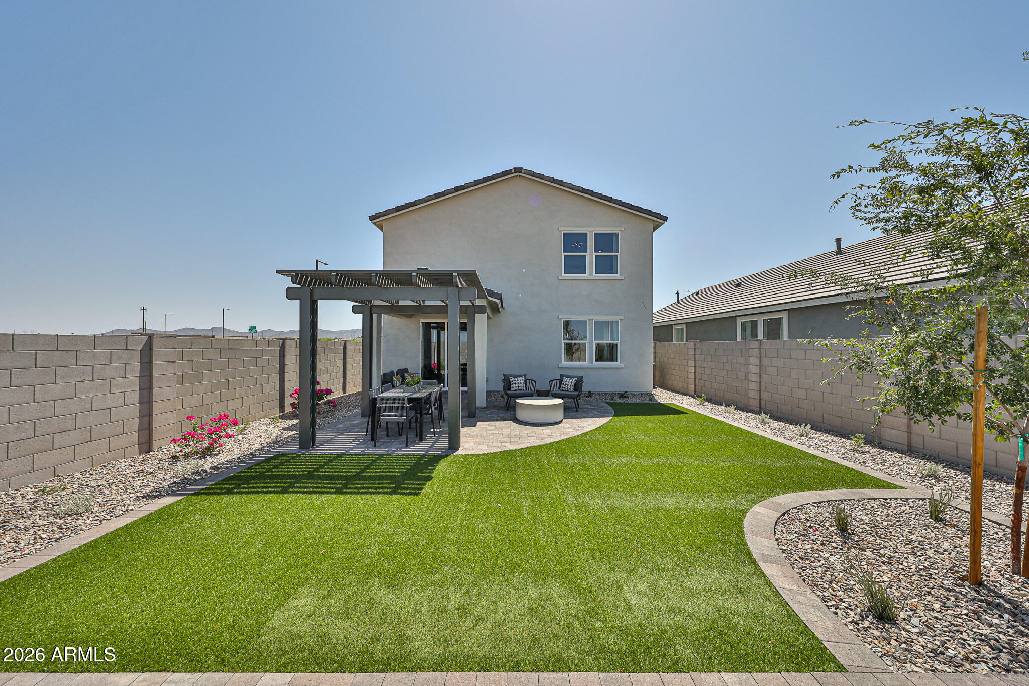 12466 North 305th Avenue Buckeye, AZ 85396 - Photo 33 of 51 a view of a house with backyard and sitting area