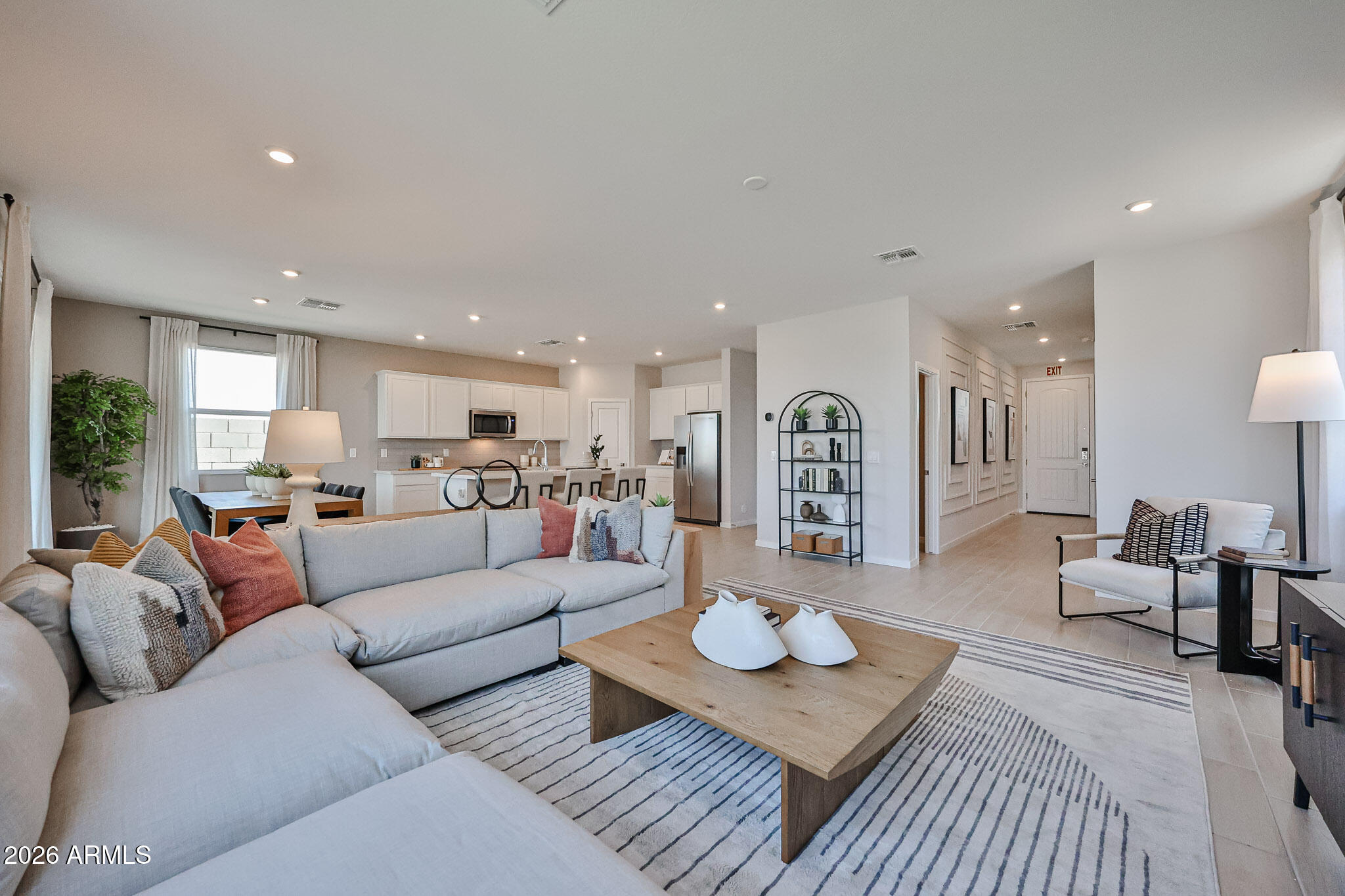 12466 North 305th Avenue Buckeye, AZ 85396 - Photo 38 of 51 a living room with furniture kitchen view and a table