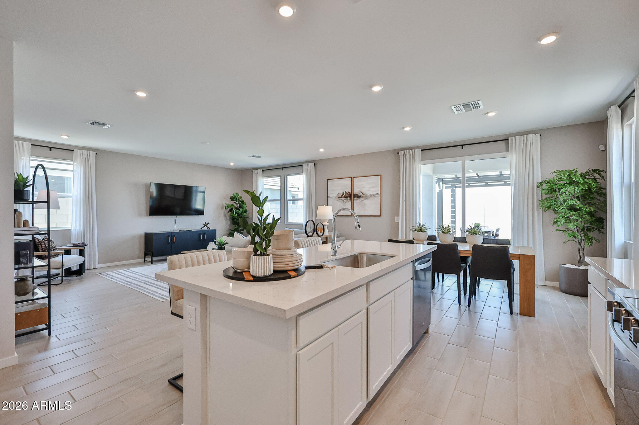 12466 North 305th Avenue Buckeye, AZ 85396 - Photo 41 of 51 a view of a dining room and livingroom with furniture window and wooden floor