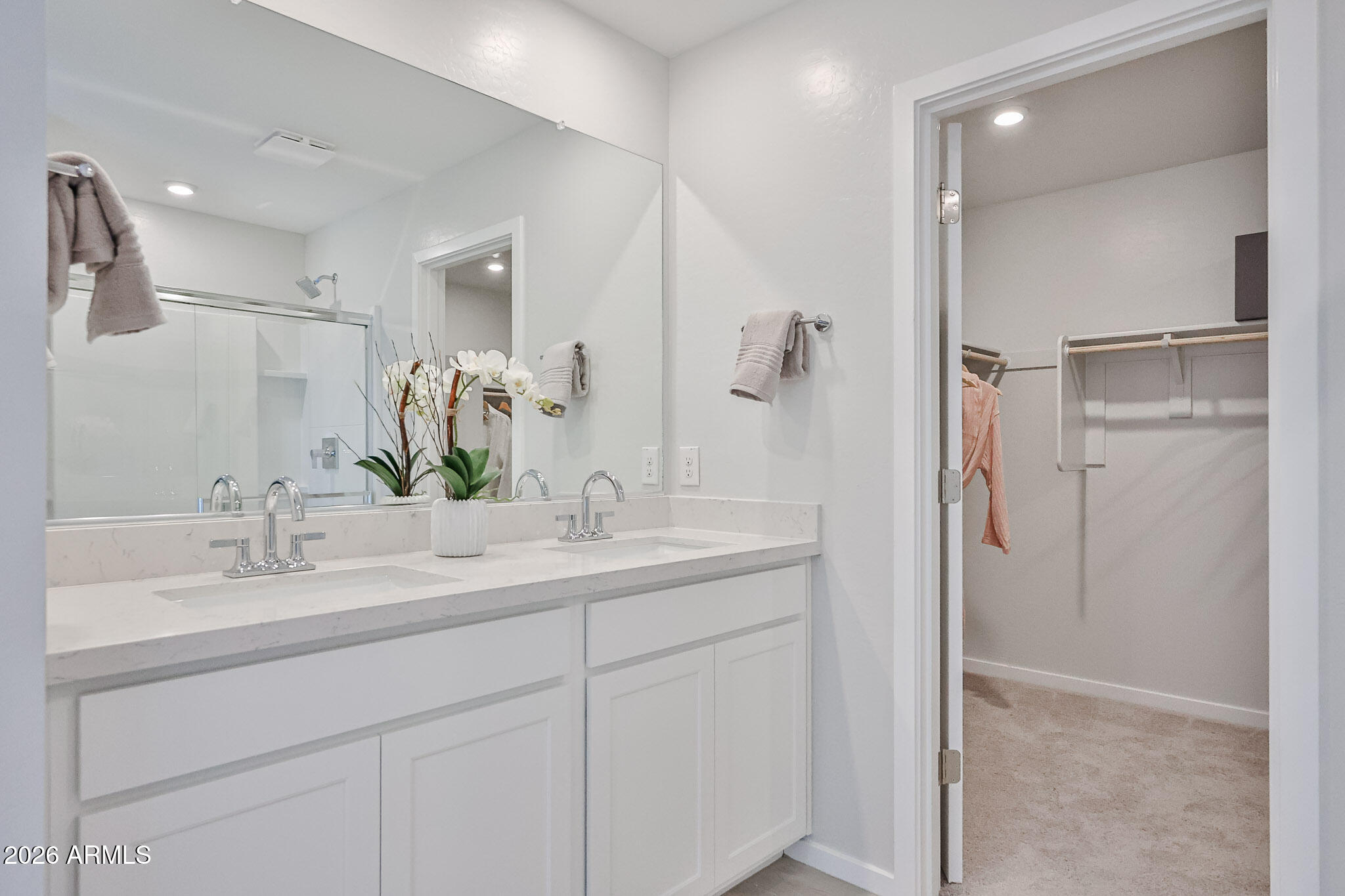 12466 North 305th Avenue Buckeye, AZ 85396 - Photo 50 of 51 a bathroom with a double vanity sink mirror and shower