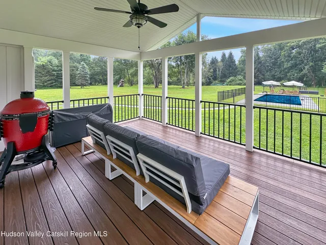 a view of a patio with wooden floor