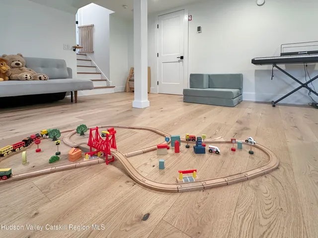 a view of a chair and table in backyard of the house