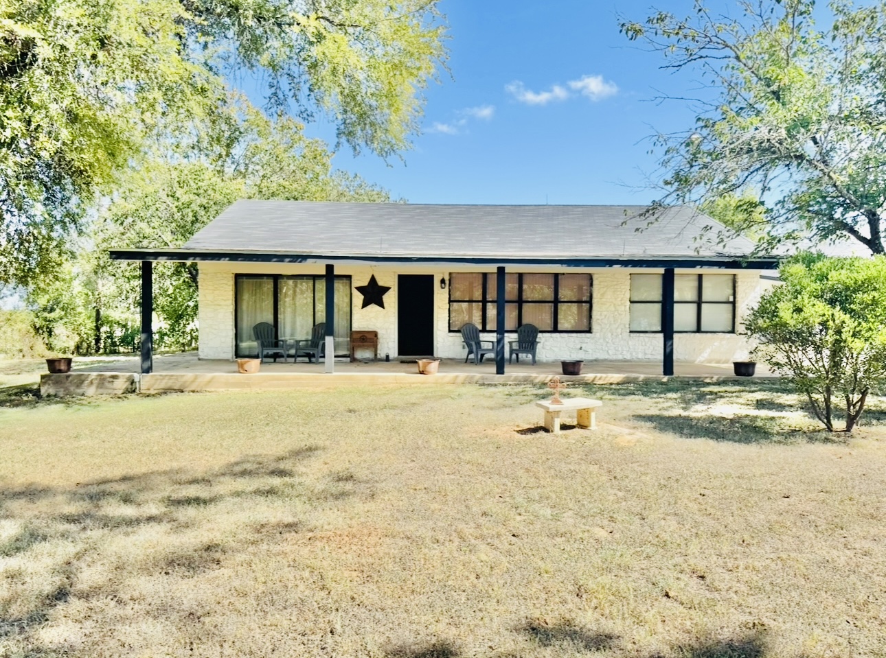 702 Pleasant Grove Road Elgin, TX 78621 - Photo 2 of 38 Front of house with covered porch and brick siding